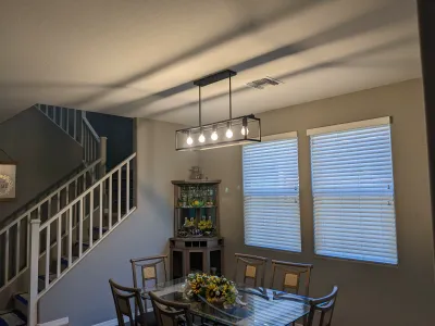 Finished hanging light fixture installation in Mesa